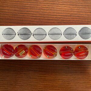 Set of Pukeberg glass knife rests, brand new in box, red